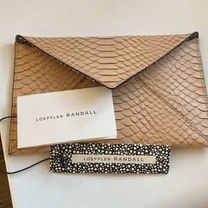 NTW Loeffler Randall embossed snake skin clutch.